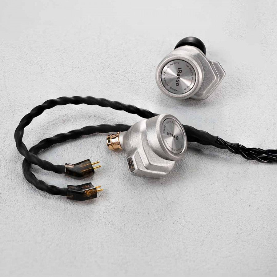 IBasso £T-154 Silver IEMs on a concrete background